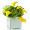 Faux yellow calla, green dianthus, pin cushion protea in mirror cube vase