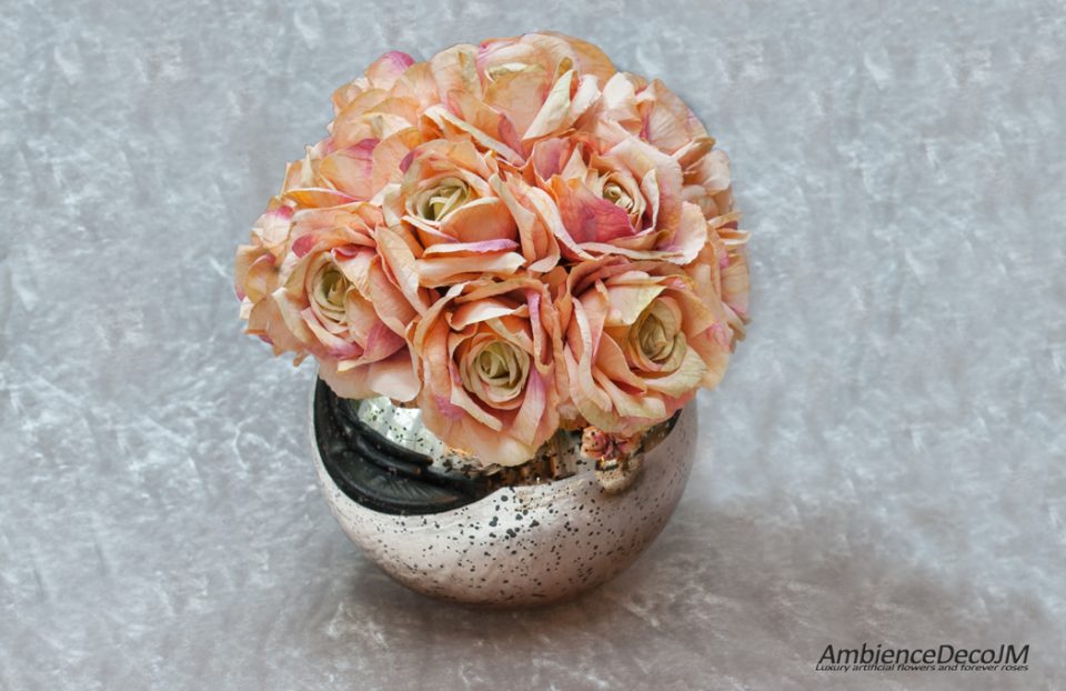 Silk tea roses in a fishbowl