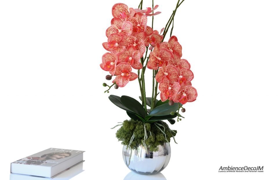 Lifelike red orchids in a vase