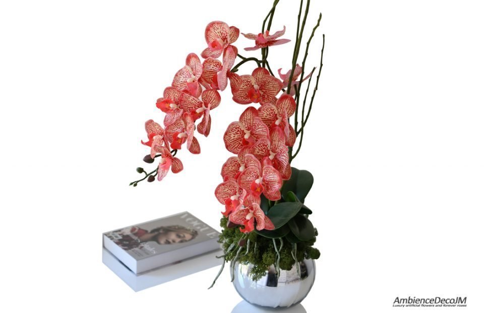 Lifelike red orchids in a vase